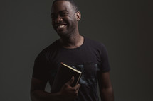 happy man holding a BIble 