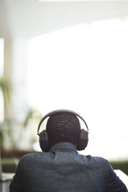 a man listening to headphones.