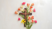 The cross surrounded by flowers
