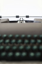 Vintage typewrite with a blank page.