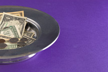 offering tray on a purple background 