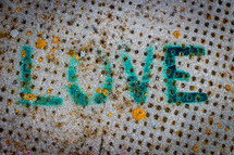 love spray painted on concrete 
