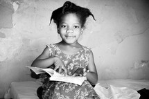 girl child reading a Bible 
