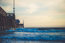 Waves rolling onto a shore near a pier | Man Fishing | Coastal | California | Nature | Summer | Background 