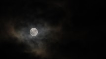 clouds moving over the full moon 