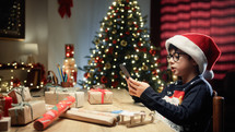 Italian Kid playing with his gift for Christmas 