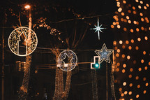Illuminated Christmas toys in the street at night