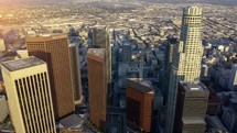 Aerial view of the Financial District in Downtown Los Angeles. Passing by Huge Office Building Skyscraper Rooftops in Downtown Los Angeles.