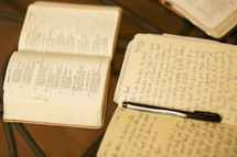 journal, pen, and open Bible