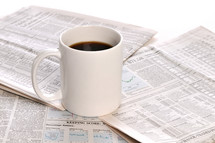 coffee mugs and newspapers 