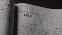 Light revealing a Bible and the Gospel of Luke