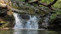 small tricking waterfall outdoors 
