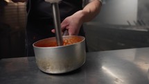 Using Tools In A Kitchen To Create Tomato Cream 