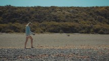 girl walking on a beach 