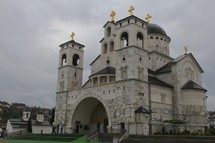 stone cathedral with gold cross toppers 