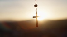  Rosary crucifix at sunset light 