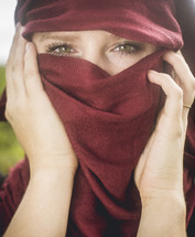 woman behind a scarf 