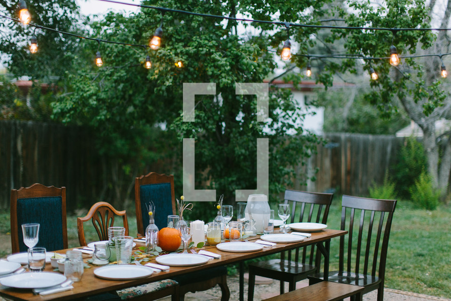 place settings on a table outdoors 