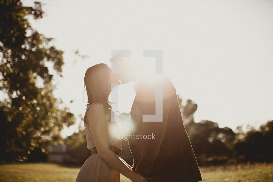 Couple kissing in the park