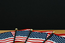 row of hand held American flags