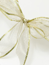 golden bow against a white background