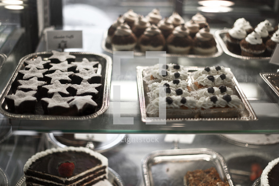 Desserts in a bakery display.