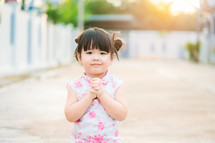 little girl with praying hands 
