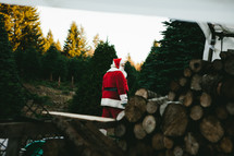 Santa in a Christmas tree lot 