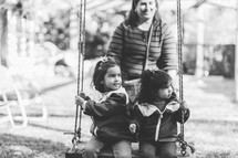 Little girls on a swing 