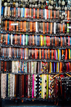 leather belts at a market in Italy 