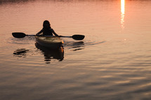kayak on the water at sunset 