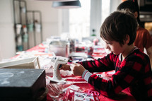a boy doing crafts at Christmas 