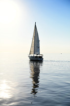 sailboat sailing on calm water 