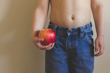 boy child holding a red apple 