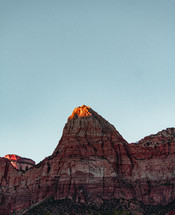 sunlight on a red rock mountain peak 