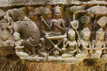 Carved stone wall relief depicting Hindu Gods