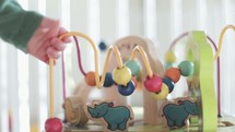 infant playing with baby toys 