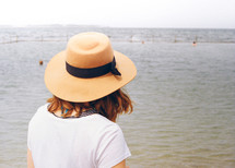 A woman overlooks an ocean pool