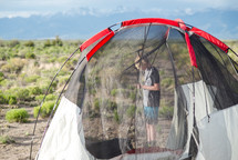 a tent and boy outdoors 