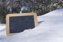 chalkboard in snow 