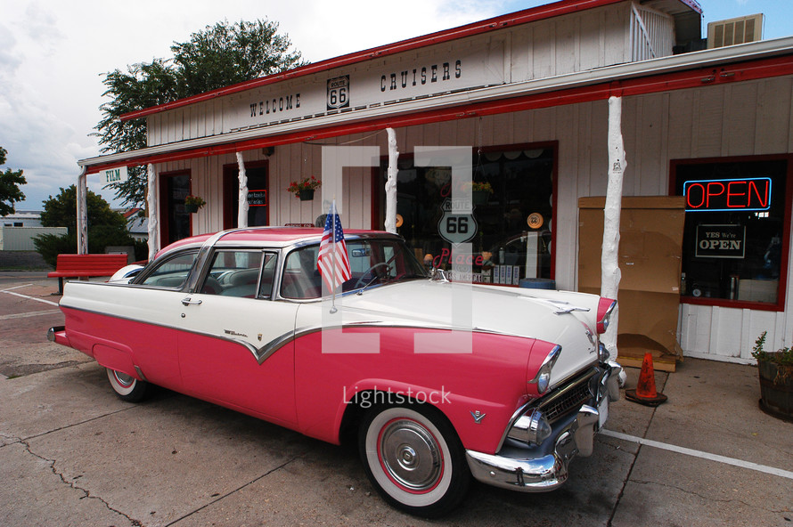 old car in front of a route 66 service station