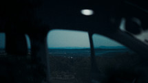 view of mountainous landscape out a car window 