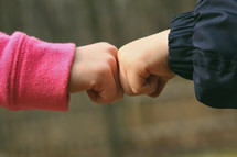 brother sister fist bump 