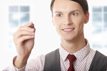 businessman holding a stylus 