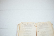 open pages of an old hymnal 