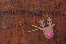 reindeer ornament on a wood background
