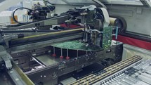 Surface Mount Technology (Smt) Machine places resistors, capacitors, transistors, LED and integrated circuits on circuit boards at high speed