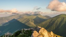 Panoramic view of green alpine mountains in sunny morning landscape Time-lapse nature
