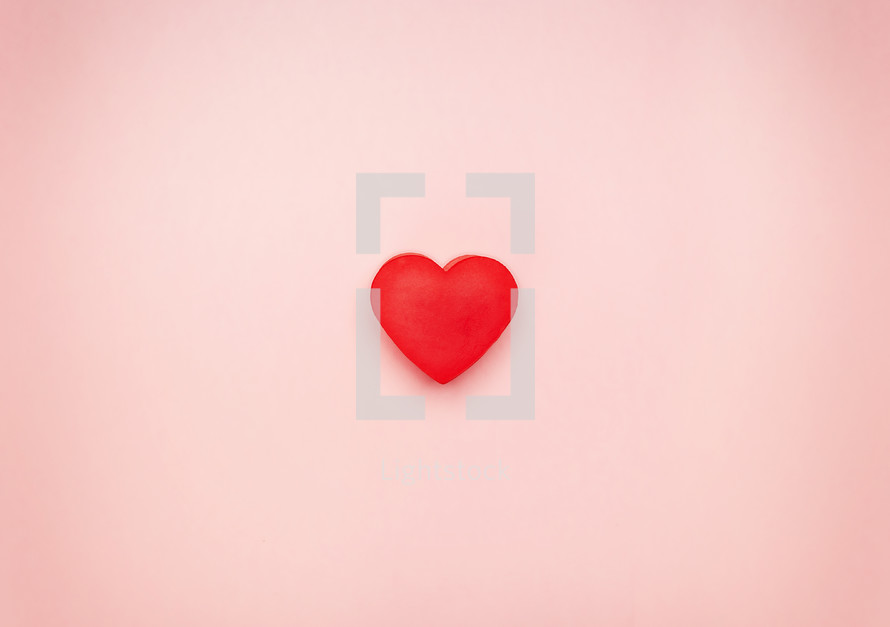 red heart on pink background 