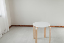 empty stool in an empty room 